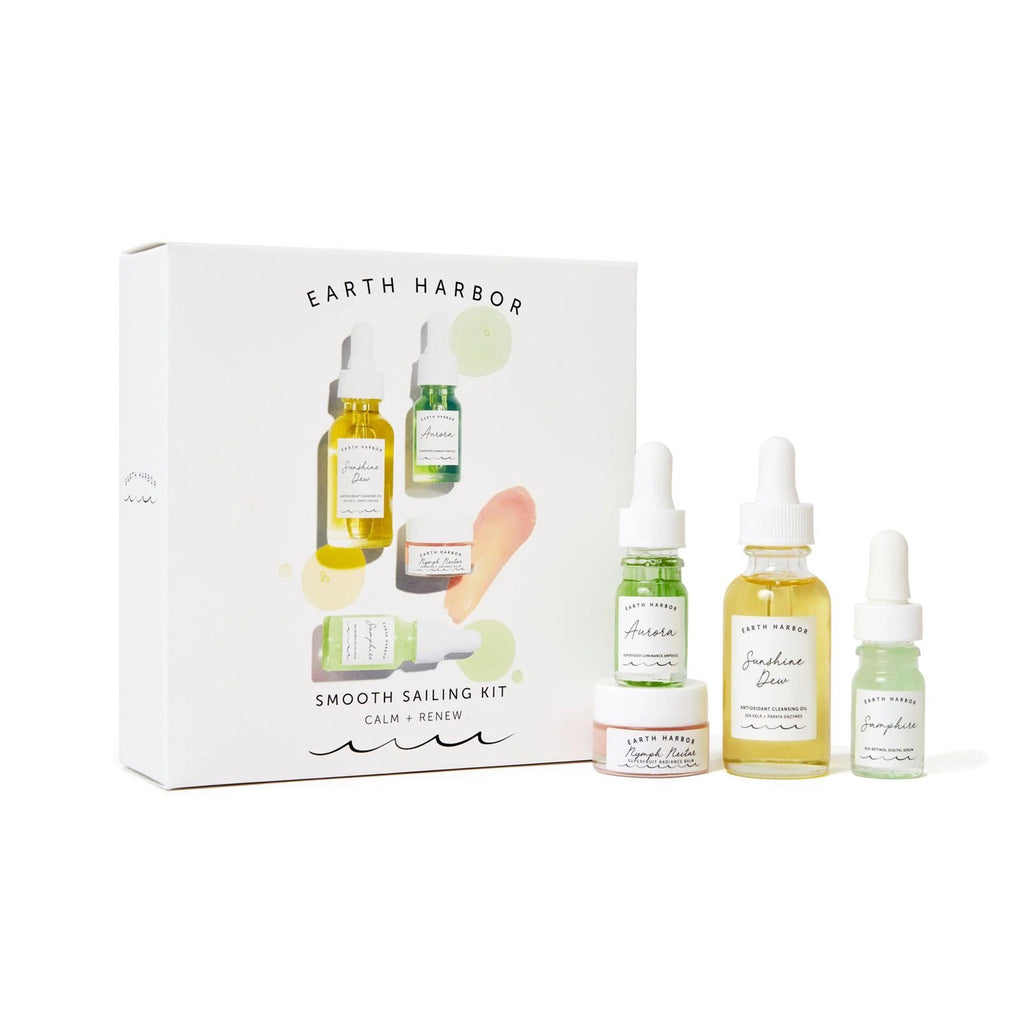 Earth Harbor Mini Smooth Sailing skincare kit to calm and renew, contents in glass bottles and jars with box packaging.