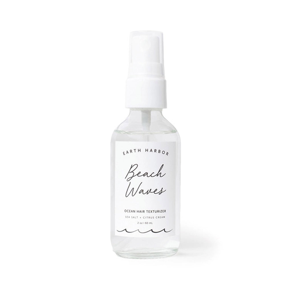 Earth Harbor Beach Waves Ocean Hair Texturizer in clear glass spray bottle, front view.