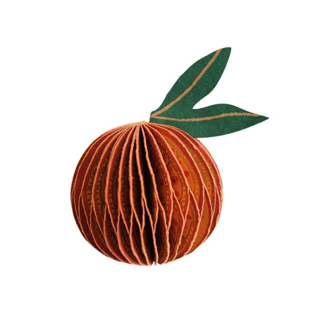 Decorative orange-shaped honeycomb paper ornament with a leaf on a white background.