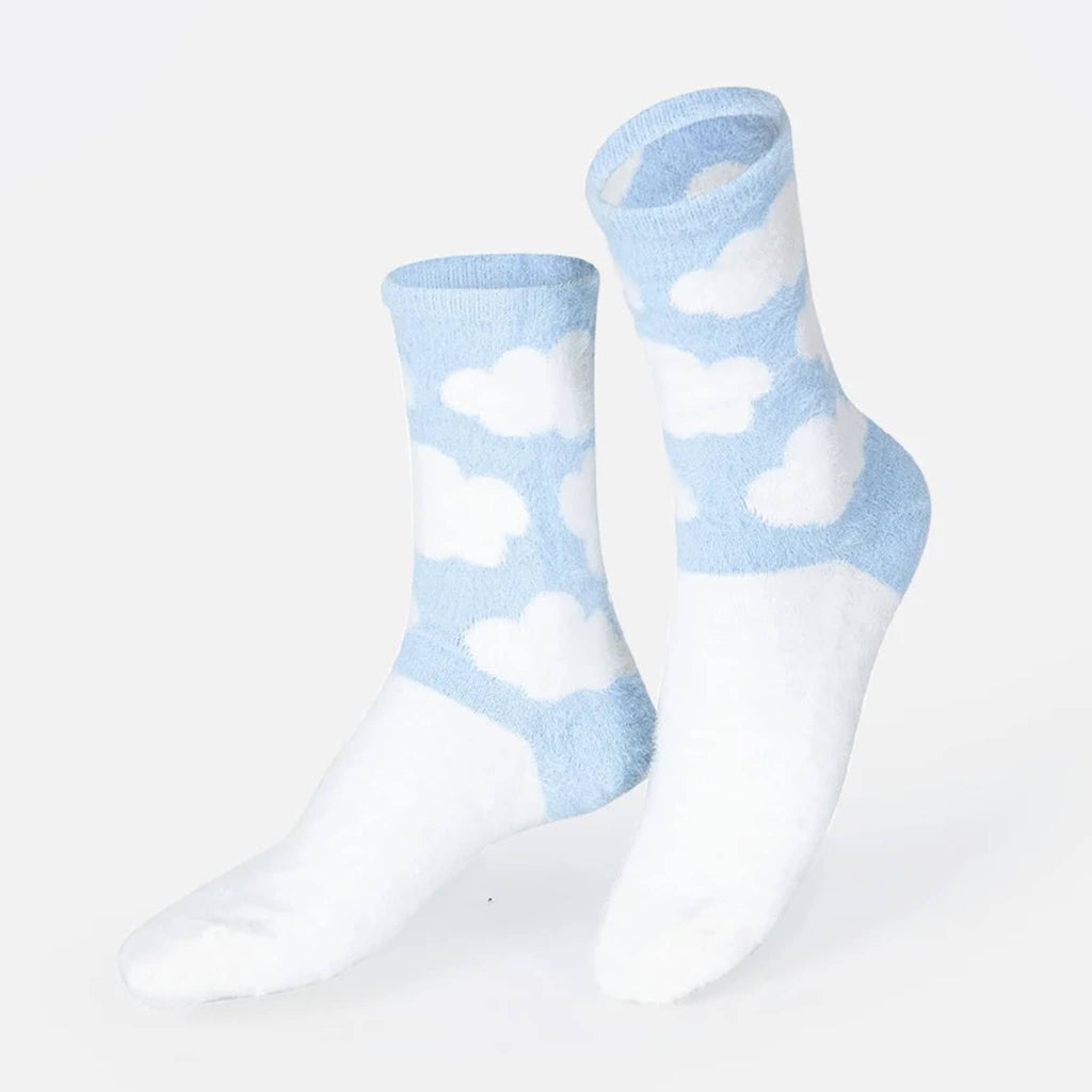 DOIY Eat My Socks Fluffy Cloud unisex crew socks with white clouds on light blue backdrop on foot forms.