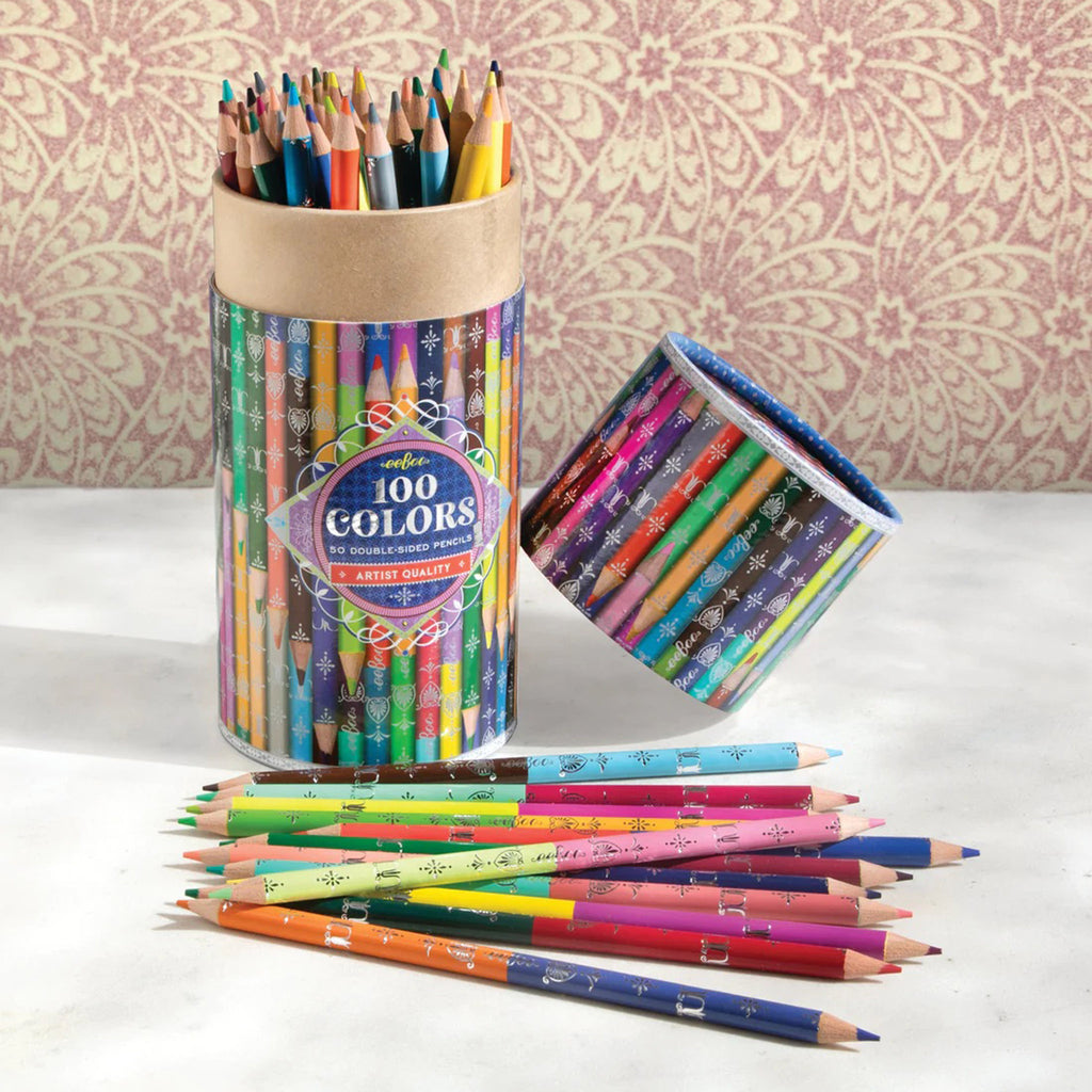 eeBoo 100 colors, 50 double-sided artist quality colored pencils in canister packaging, lid is off with some pencils inside and some on surface in front of canister.