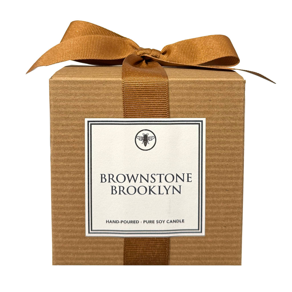 Ella B Candles Brownstone Brooklyn scented soy wax candle in kraft box with brown bow.