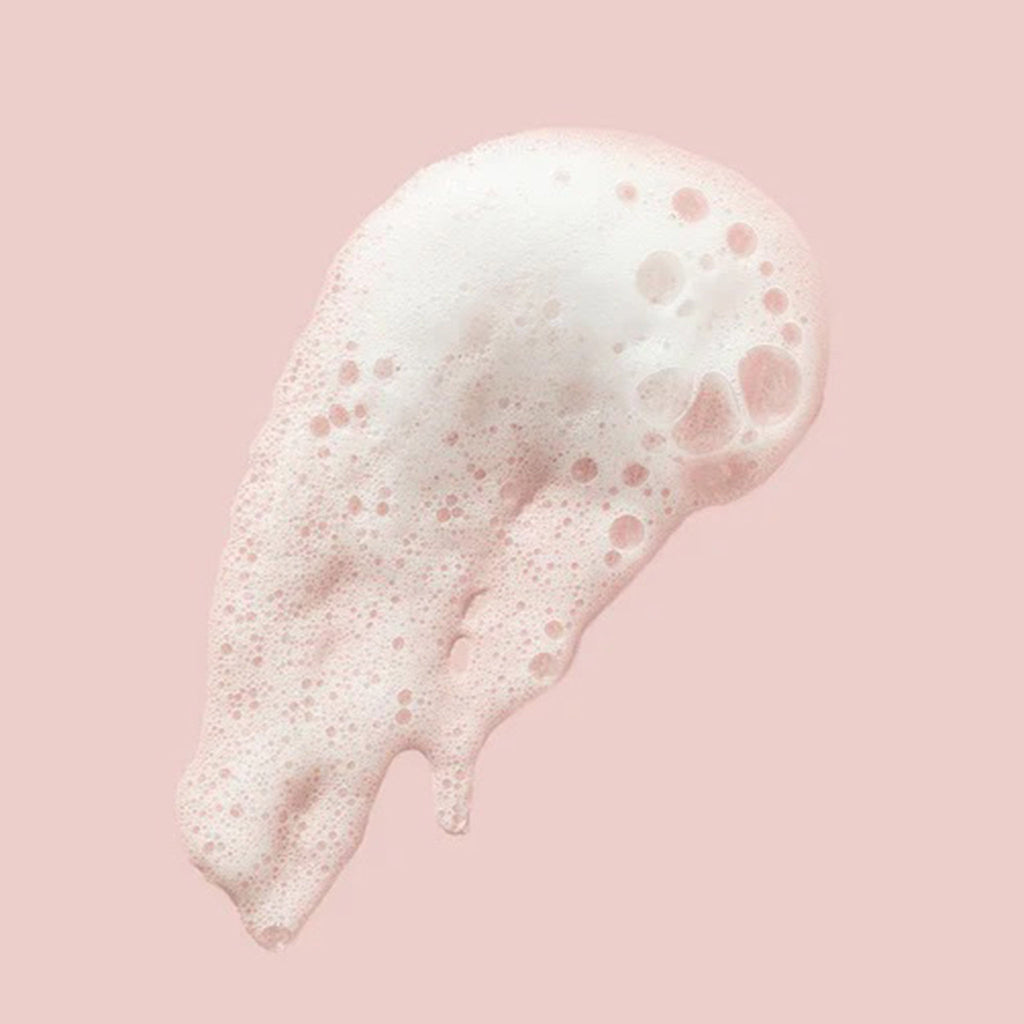 FarmHouse Fresh C the Future Foaming Facial Cleanser smear on pink background.