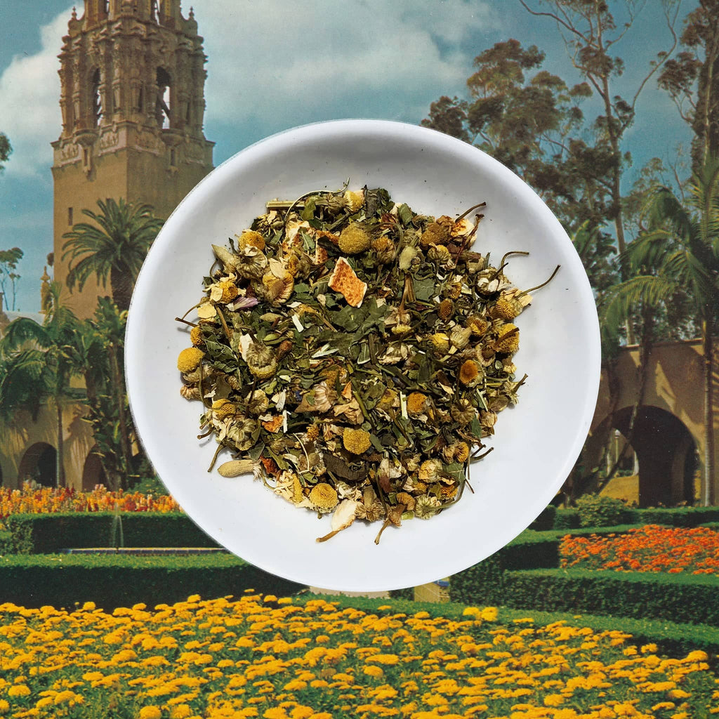 Flowerhead Tea Chronic Wellness caffeine free herbal tea blend, loose leaf in white dish.