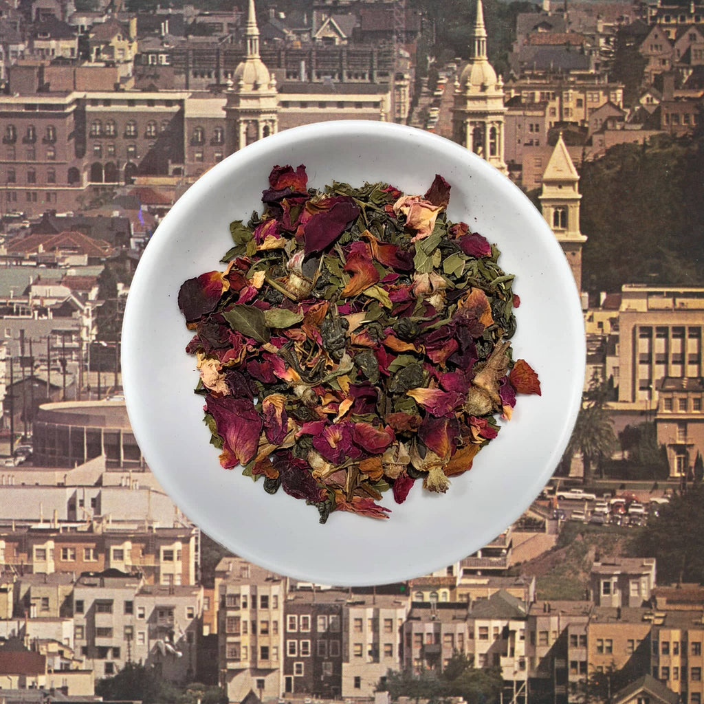 Flowerhead Tea Double Mint Rose caffeinated green tea blend, loose tea in dish.