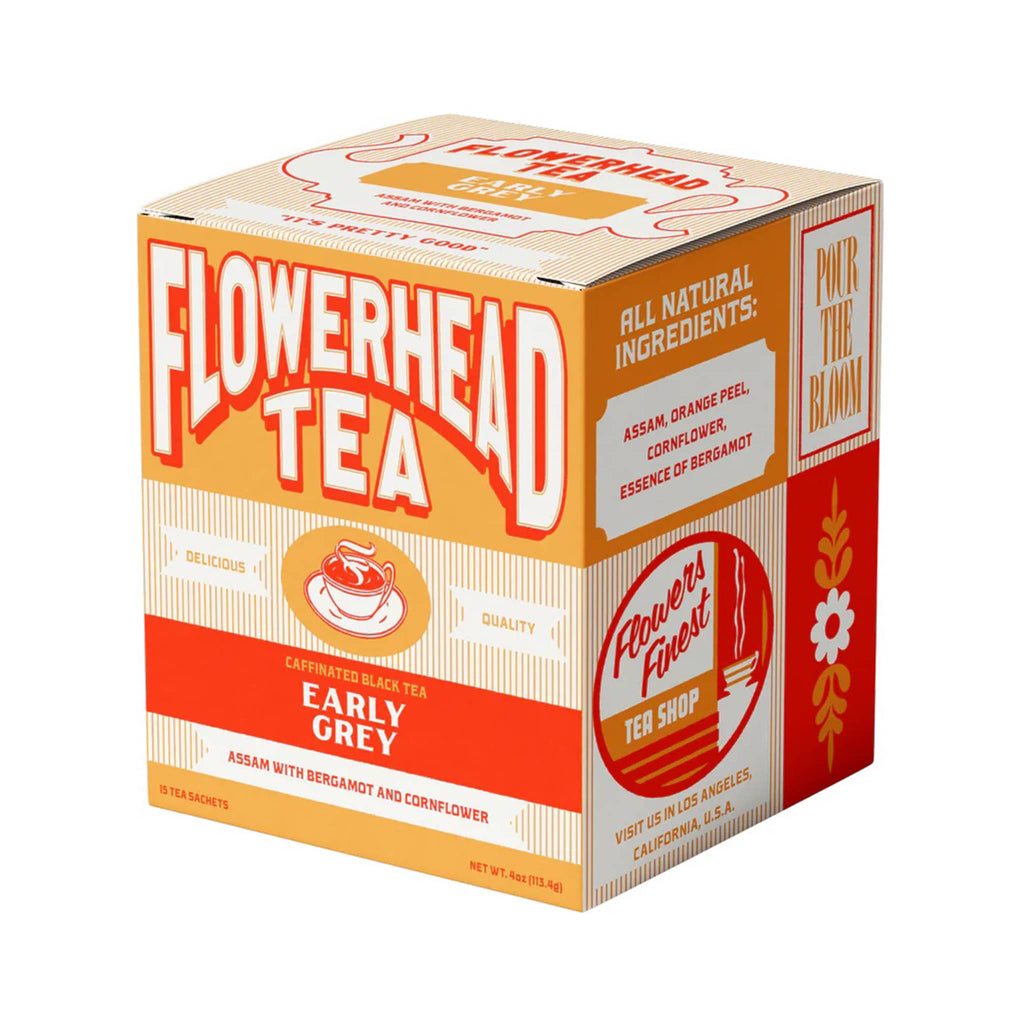 Flowerhead Tea Fuck the Grind caffeinated black tea blend tea bags in light and dark orange box packaging, front angle.