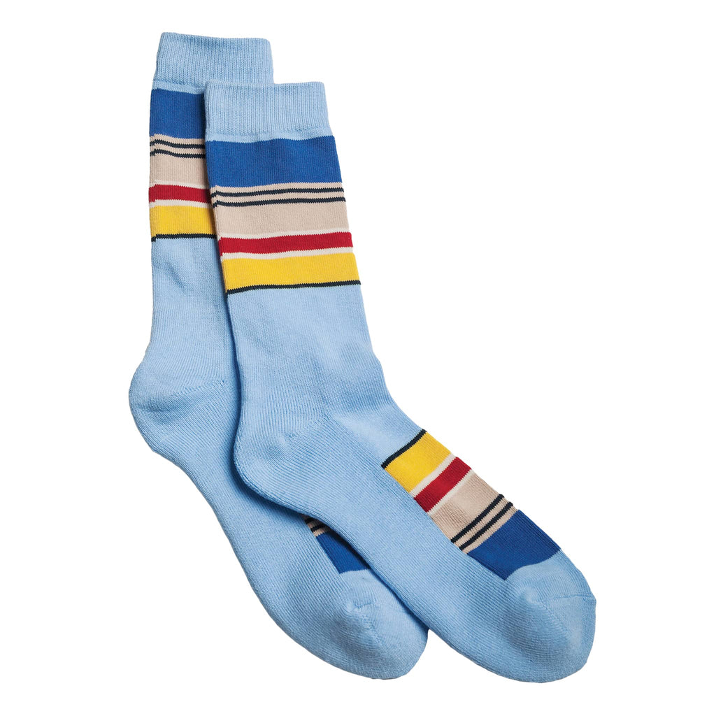 Light blue socks with colorful horizontal stripes on a white background.