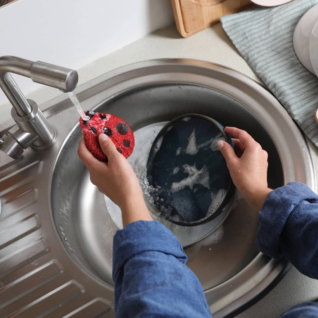 Fred Cleaning Ladies kitchen sponges that look like ladybugs, one shown with soapy dish.