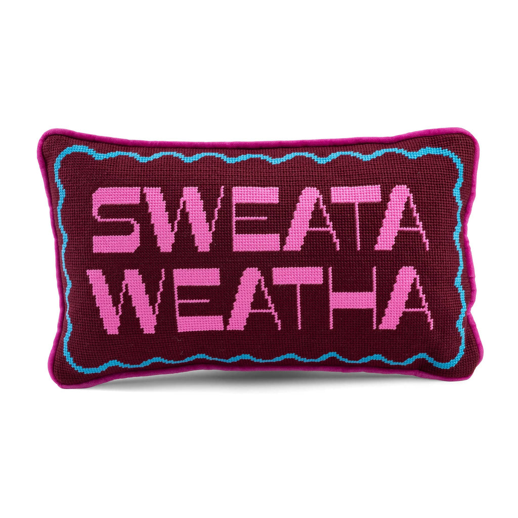 Maroon decorative needlepoint pillow with 'SWEATA WEATHA' text on a white background.