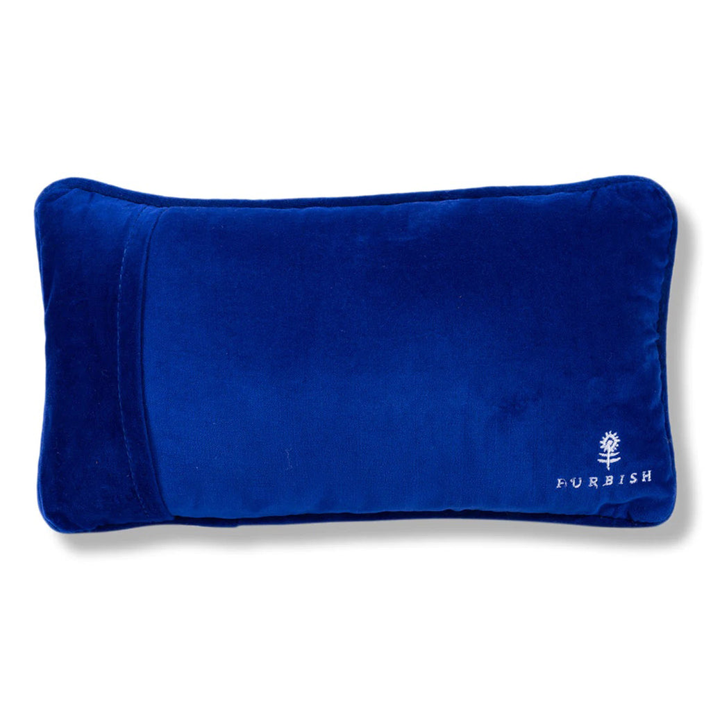 Furbish studio needlepoint pillow, back of pillow covered with cobalt blue velvet.