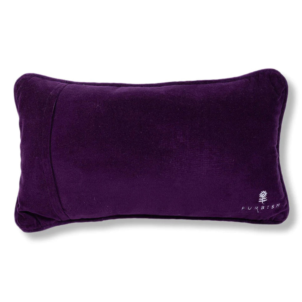 Furbish studio needlepoint pillow, back of pillow covered with dark purple velvet fabric.