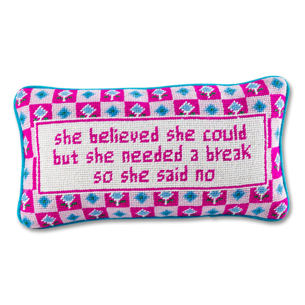 Furbish studio needlepoint pillow, cream with pink and blue checked floral pattern and "she believed she could but she needed a break so she said no" in pink on the front.