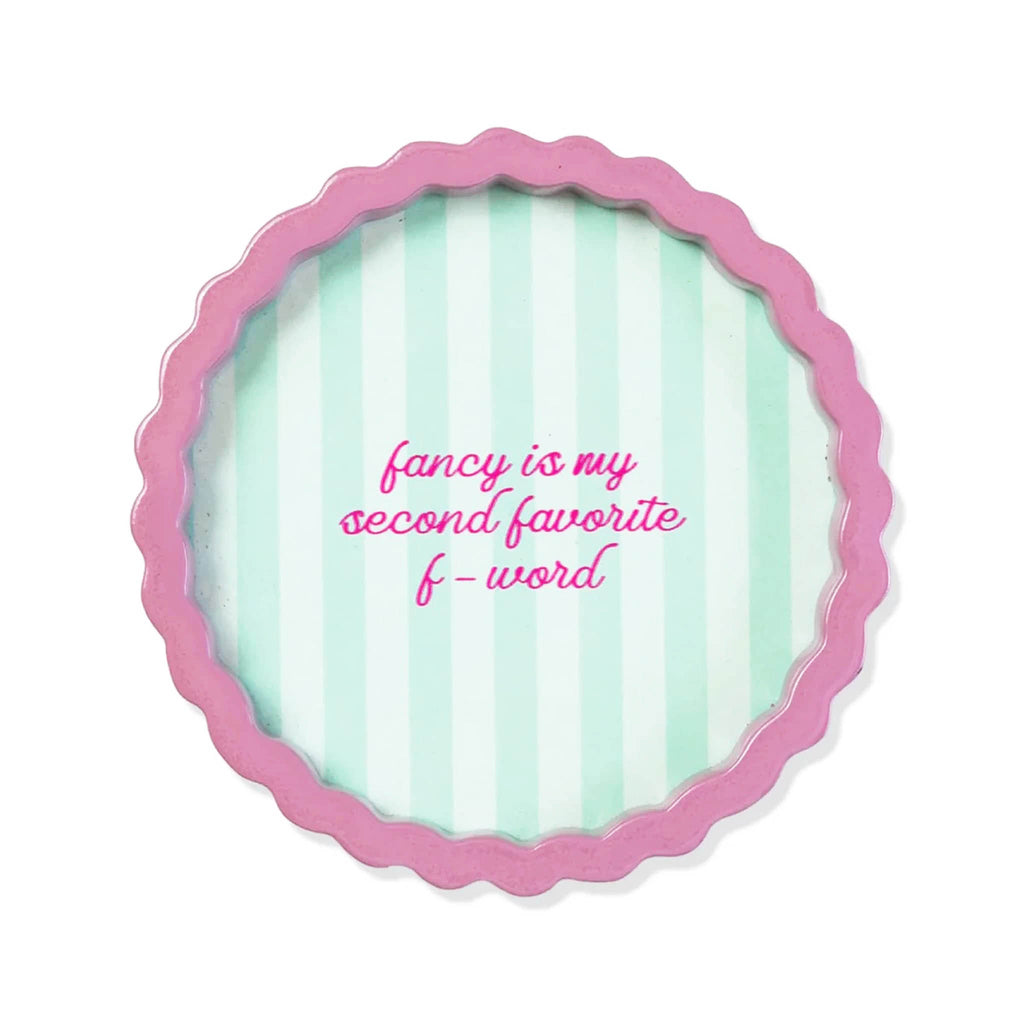 Round decorative lacquer tray with pink wavy rim and green striped background with "fancy is my second favorite f-word", on a white background.