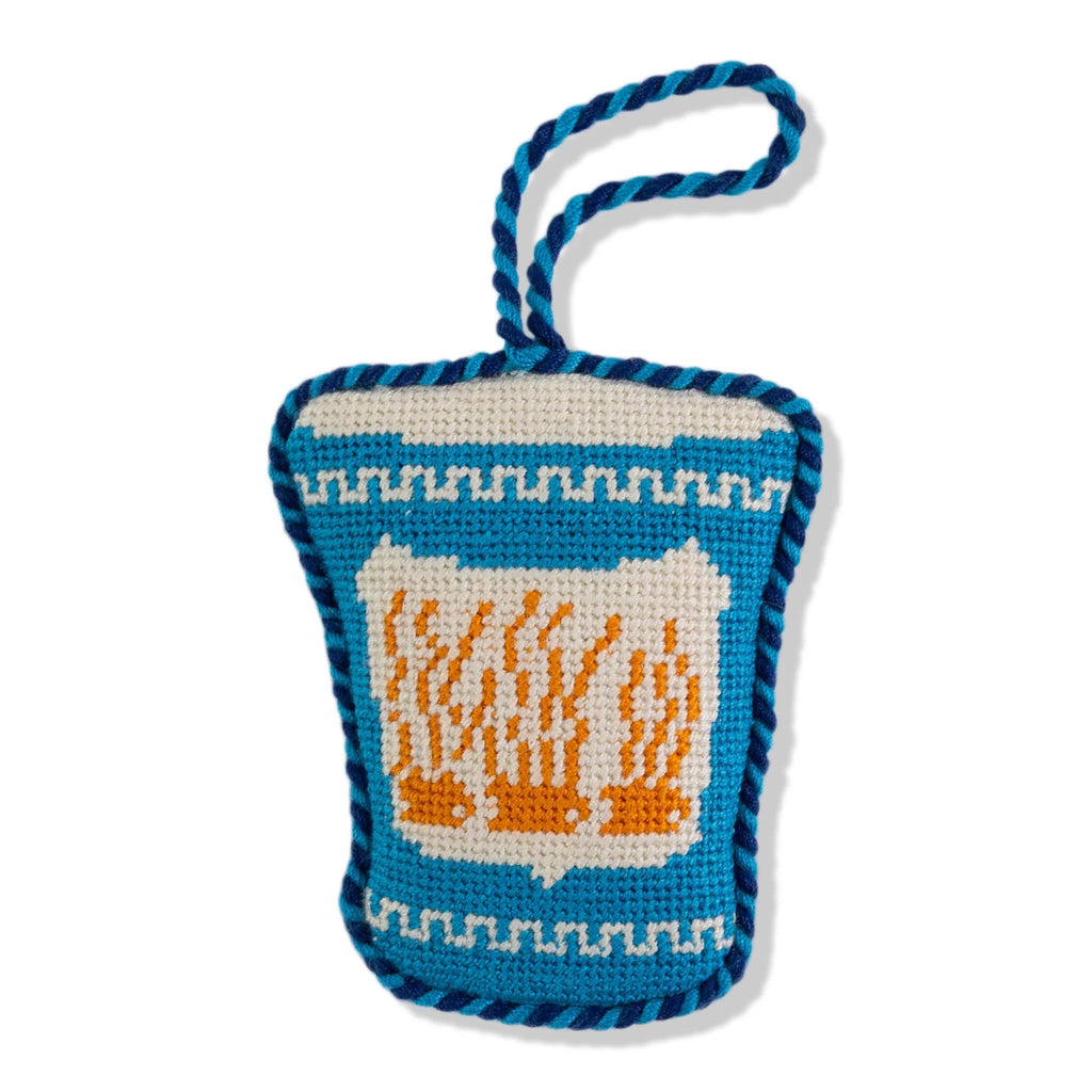 Blue and white greek coffee cup-shaped needlepoint ornament with a hanging loop on a white background.