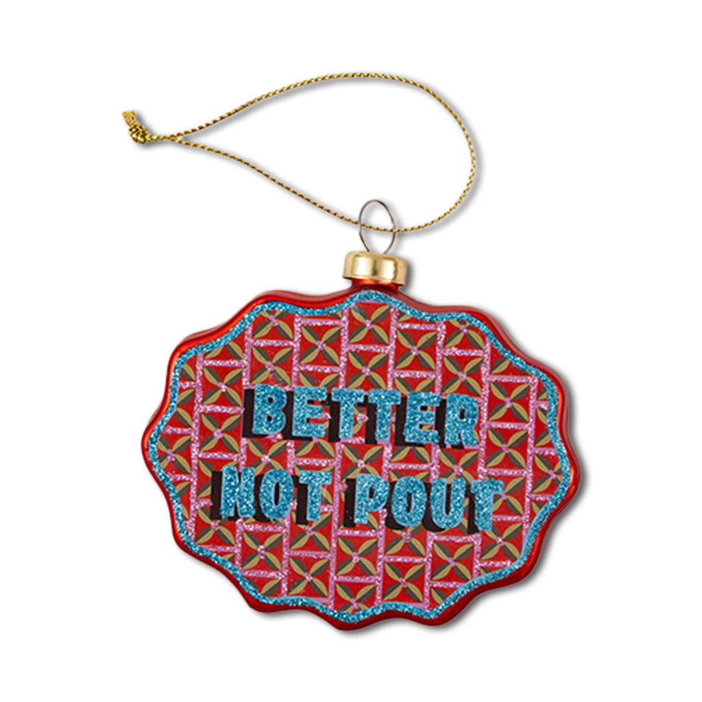 Decorative glass ornament with scalloped edge and 'Better Not Pout' text on a white background.
