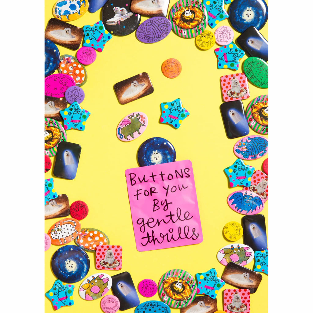 Collection of colorful buttons on a yellow background with a hot pink pouch that says 'Buttons for you by gentle thrills' in black text.