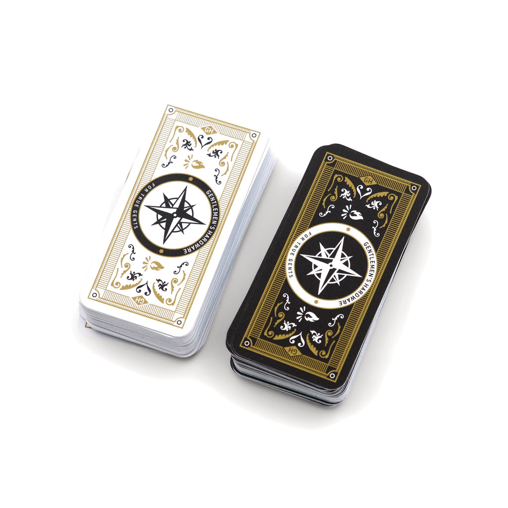 Gentlemen's Hardware Campfire Quandary card game, stack of long thin playing cards, half with white back and half with black back.