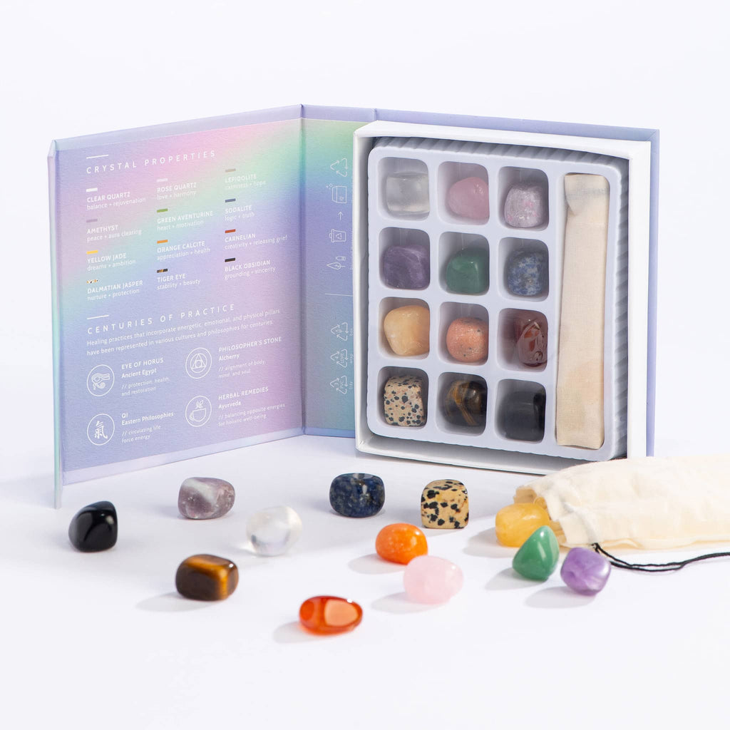 GeoCentral Healings Stones crystal set in light purple box packaging, open with contents also shown in front loose.