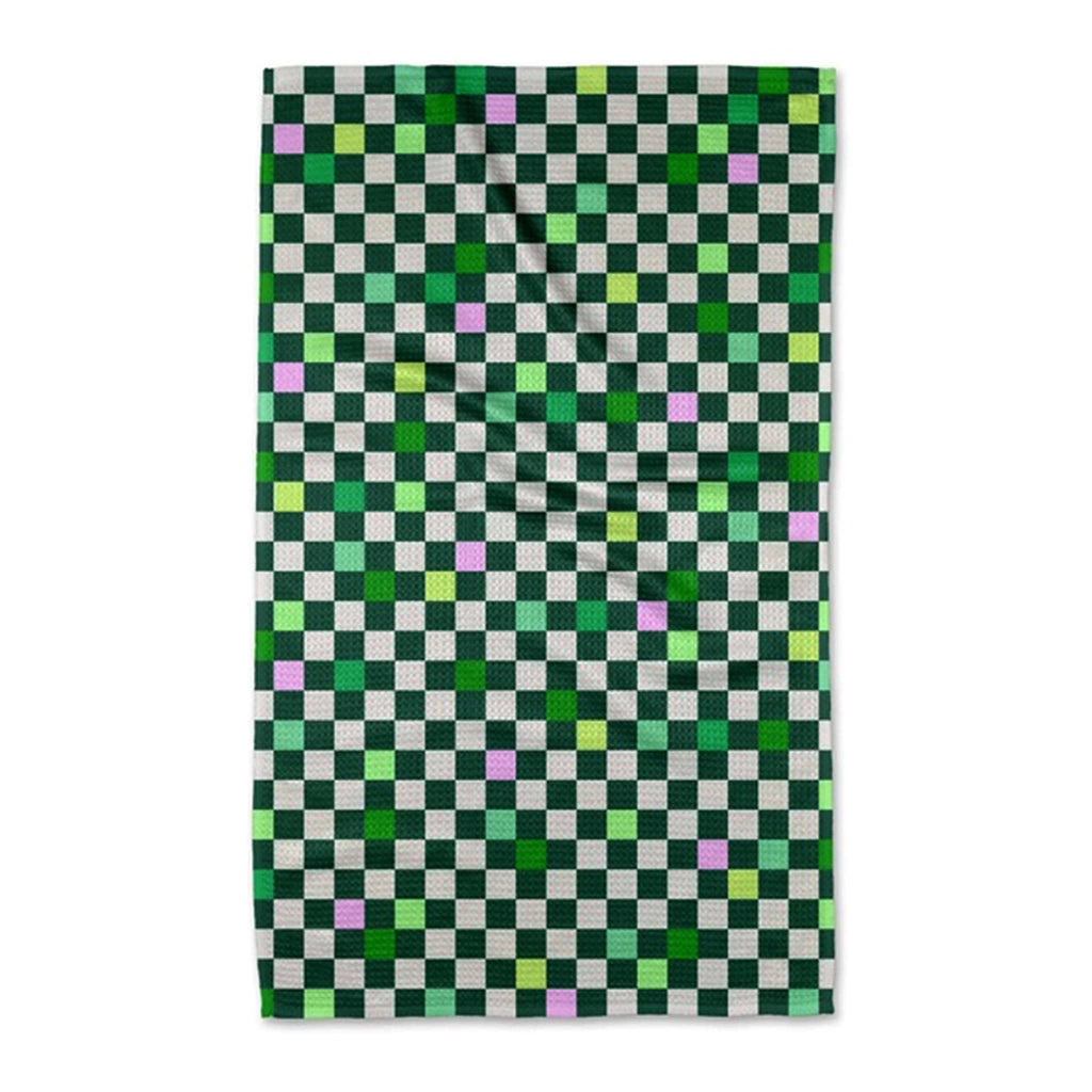 Geometry Magical Checkers eco-friendly kitchen tea towel with a green and purple checked print.