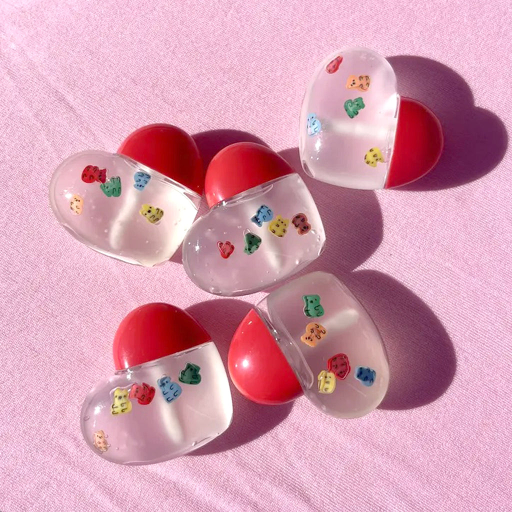 Gia Taylor Gummy Candy Heart-Shaped Pocket Lip Gloss with applicator and colorful polymer clay gummy bear pieces in clear gloss.