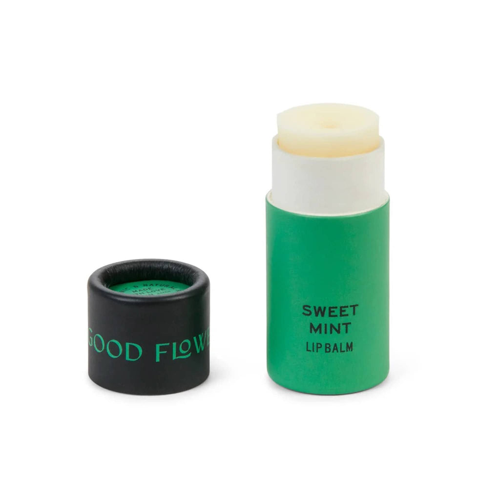 Good Flower Farm Sweet Mint scented lip balm in green paper tube packaging with lid off.