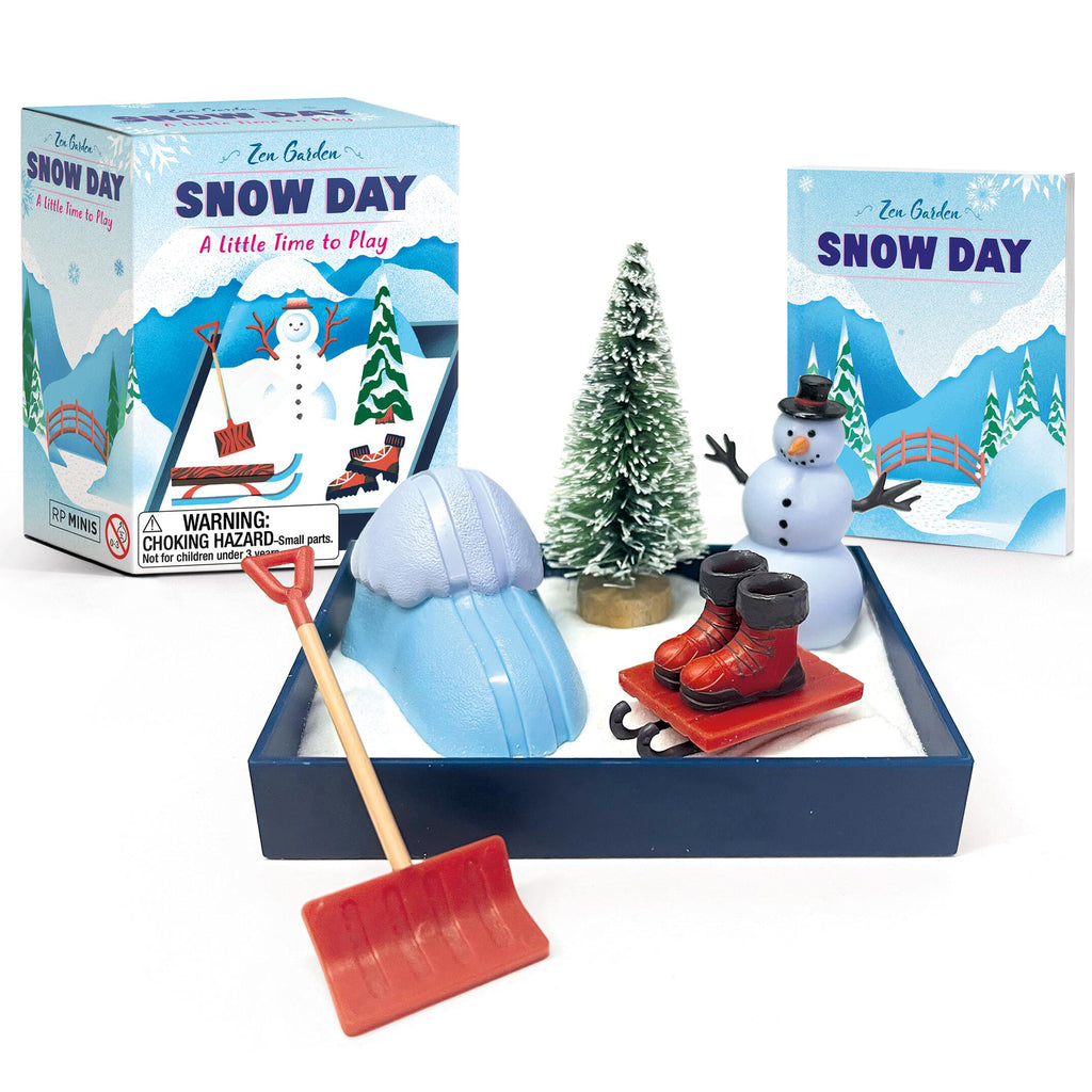 Hachette Zen Garden Snow Day mini kit with mini white sand in box with sled, boots, ski ramp, snowman, tree, shovel, mini book and box packaging.