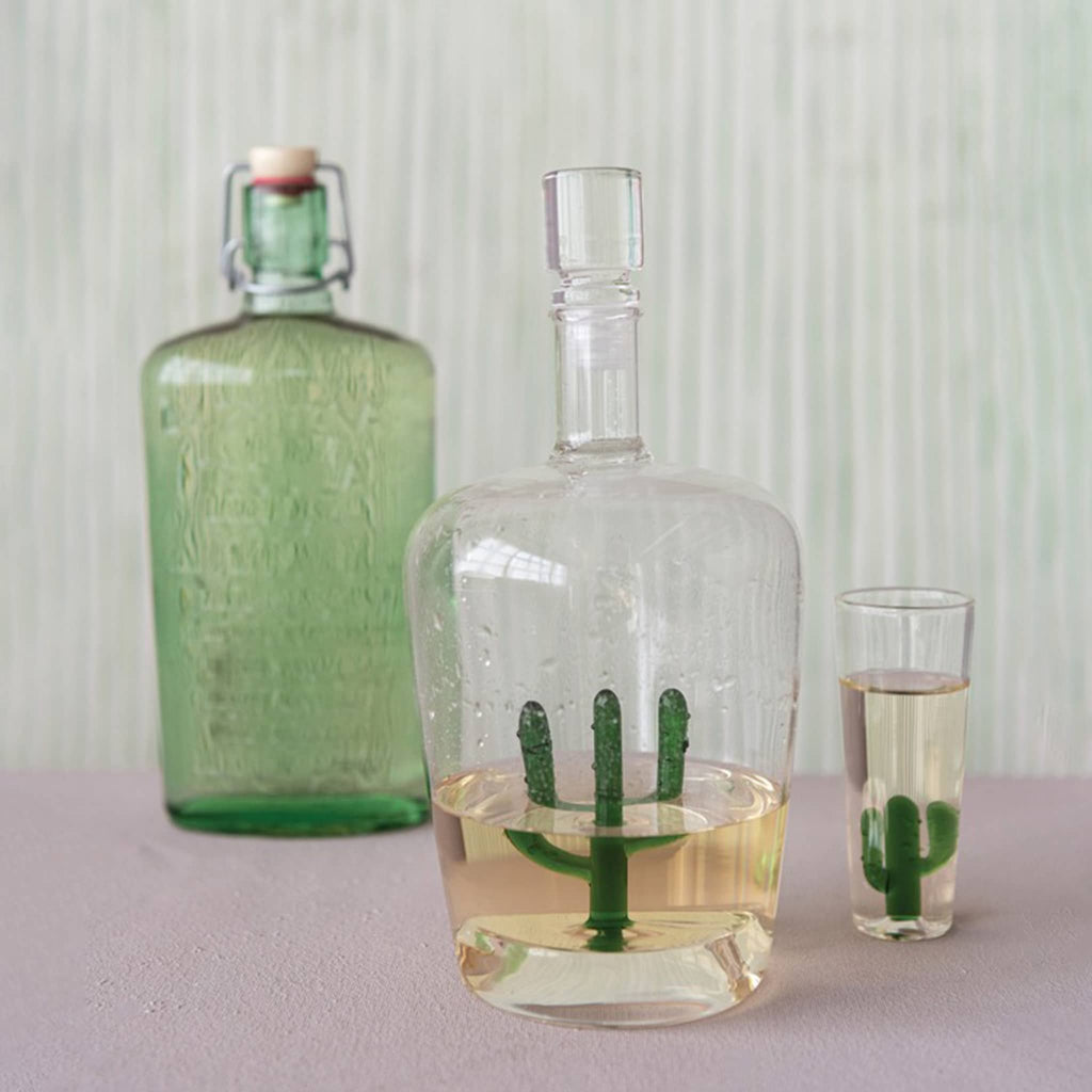 Hazel Mazel Cactus Shot Glass with matching decanter and green glass bottle.