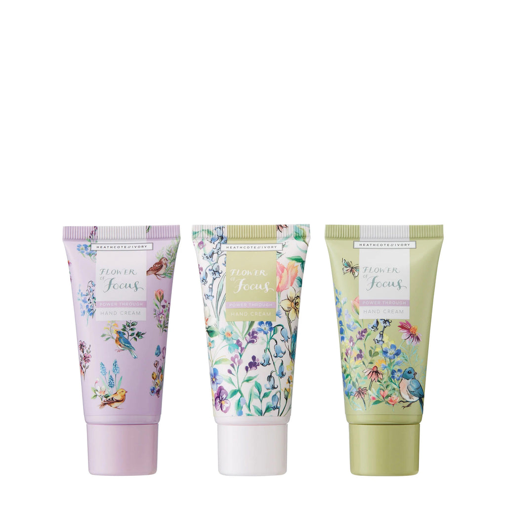 Heathcote & Ivory Flower of Focus Power Through Hand Cream Trio in floral printed tubes in lavender, white and sage green.
