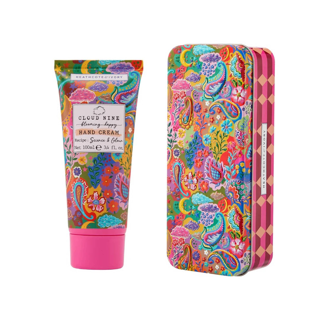 Heathcote & Ivory Cloud Nine Blooming Happy 3.4 ounce Hand Cream tube with collectible tin packaging, both with a colorful paisley print.