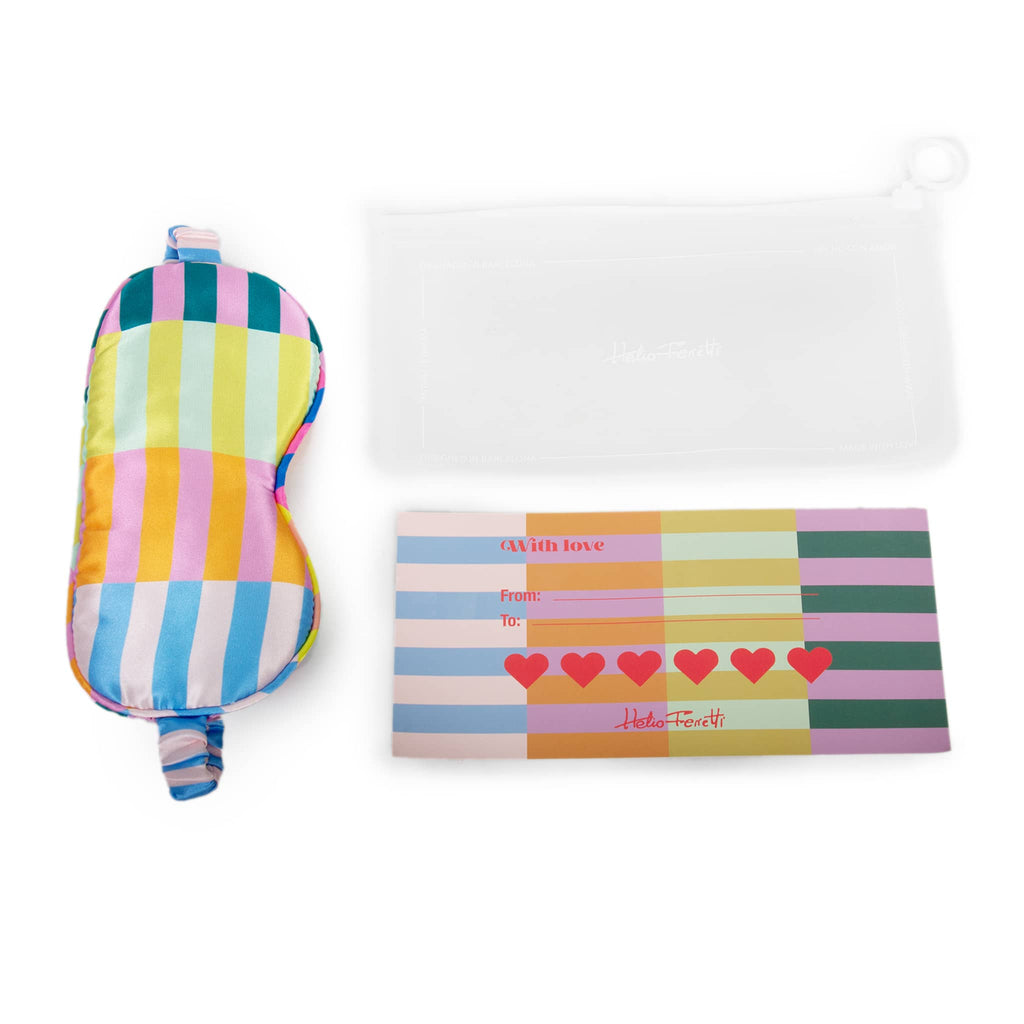 Helio Ferretti multicolored stripe satin sleep eye mask, with pouch packaging and insert.