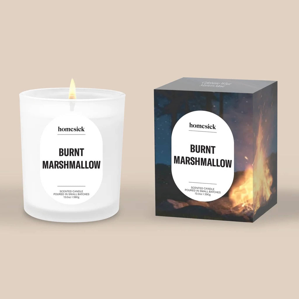 Homesick 'Burnt Marshmallow' candle and packaging on a beige background.
