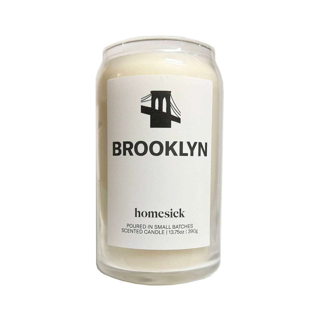 Homesick Brooklyn scented candle in can-shaped glass vessel.