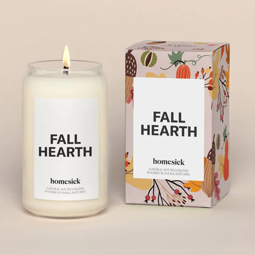 Homesick Candles Fall Hearth scented candle made with a natural soy wax blend in a glass can-shaped vessel with fall-themed box packaging.
