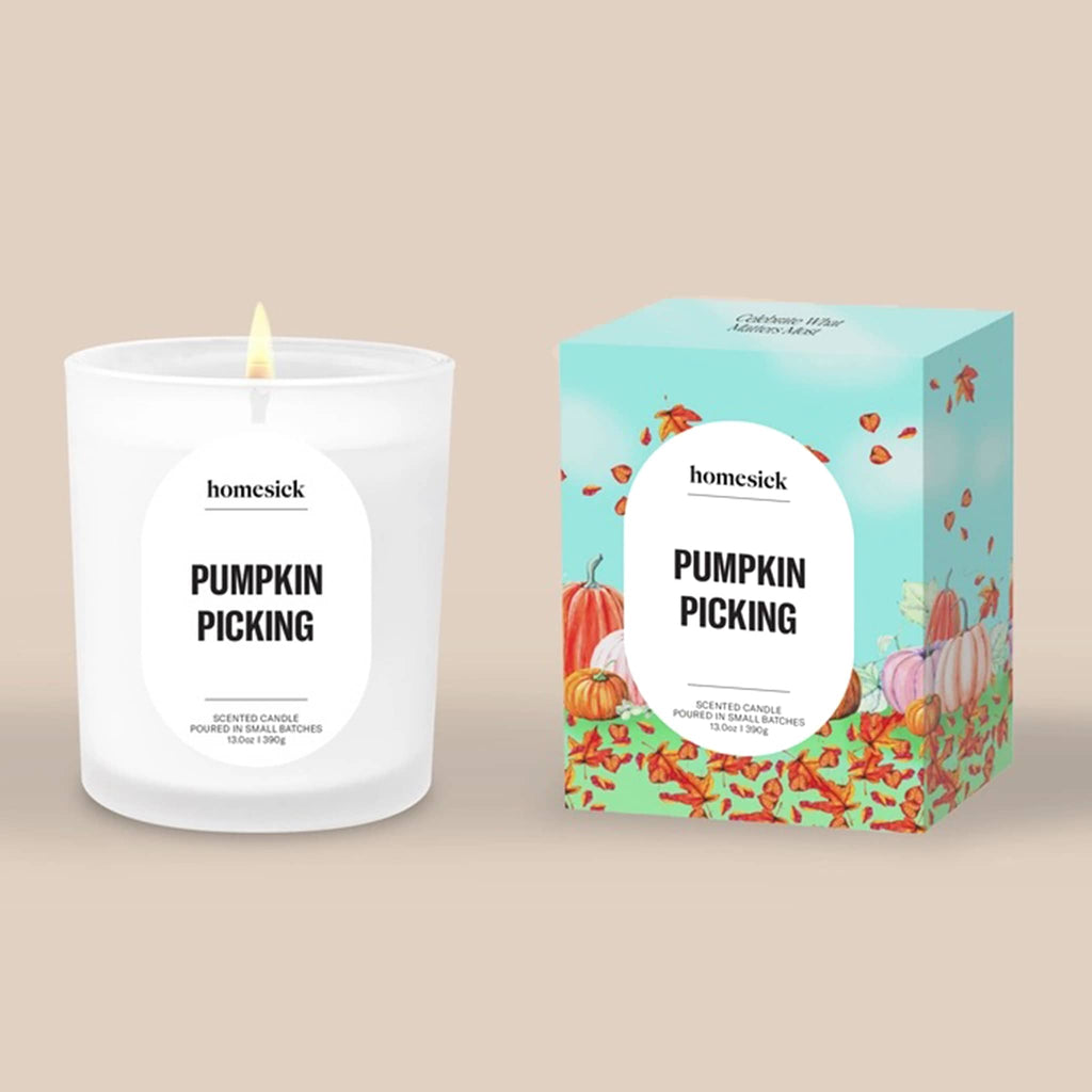 Homesick Pumpkin Picking candle and packaging on a beige background.