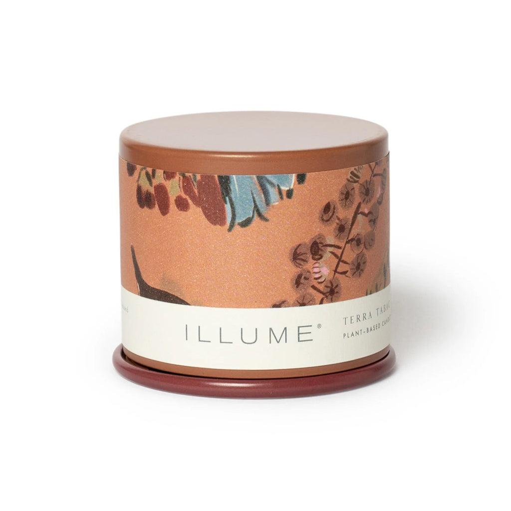 Illume Terra Tabac scented plant based wax candle in demi vanity tin, front view with lid on.