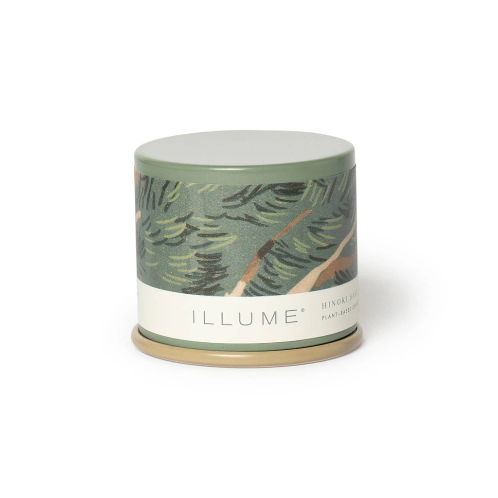 Illume Hinoki Sage scented candle in patterned green tin with lid.