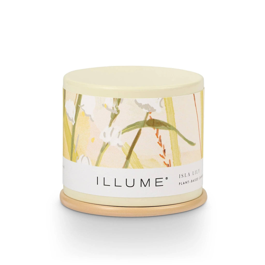 Illume Isla Lily scented plant based wax candle in demi vanity tin, front view with lid on.