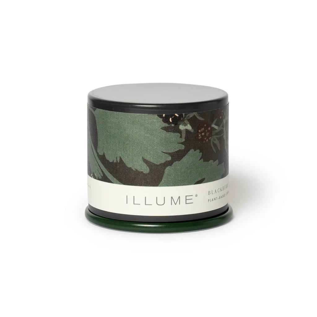 Illume Blackberry Absinthe scented candle in patterned dark green tin with lid.