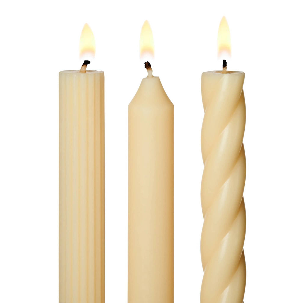 Illume Ivory Set of 3 taper candles in assorted textures, detail with wick lit.