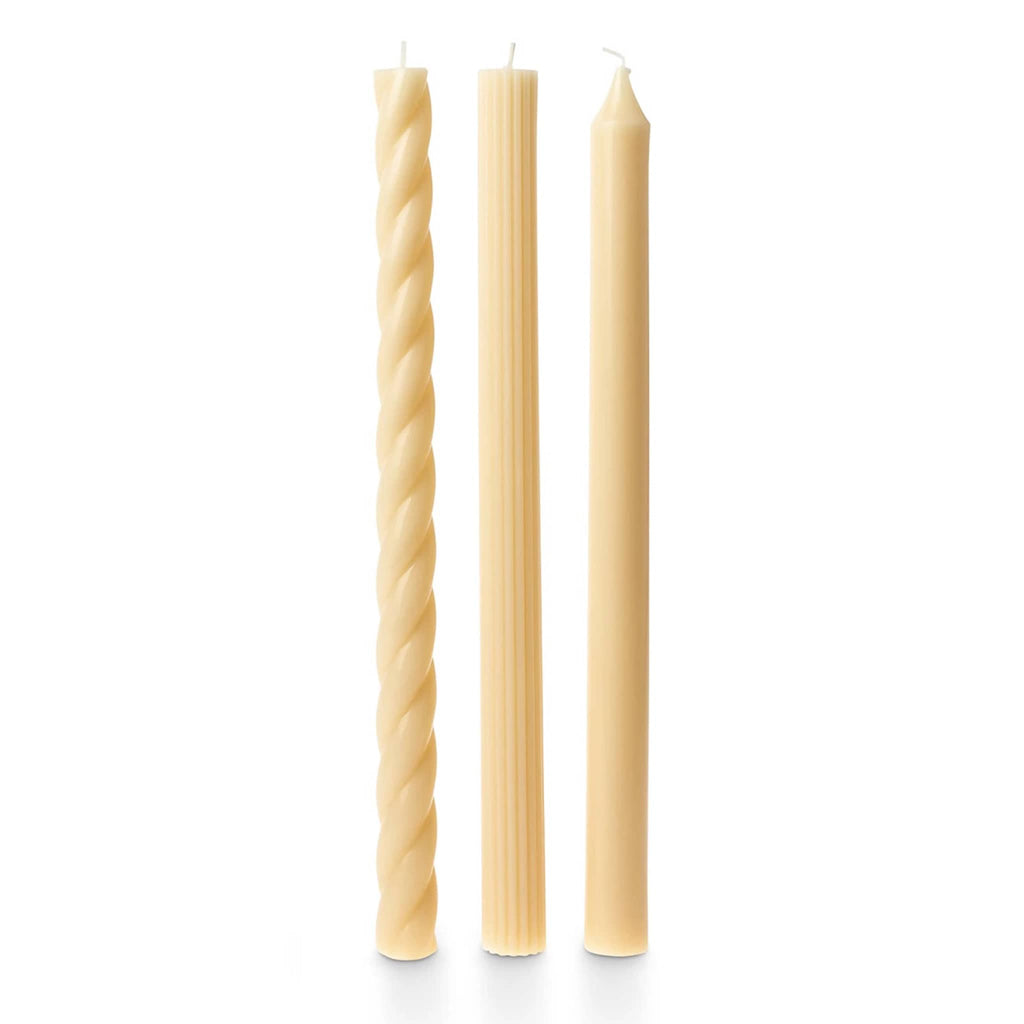 Illume Ivory Set of 3 taper candles in assorted textures.