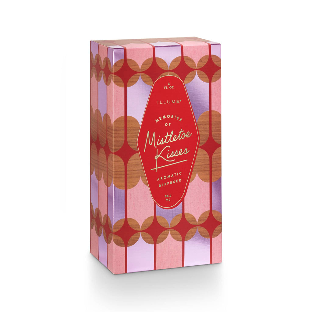 Illume Memory Lane Mistletoe Kisses scented holiday diffuser in geometric patterned red, pink and purple gift box.