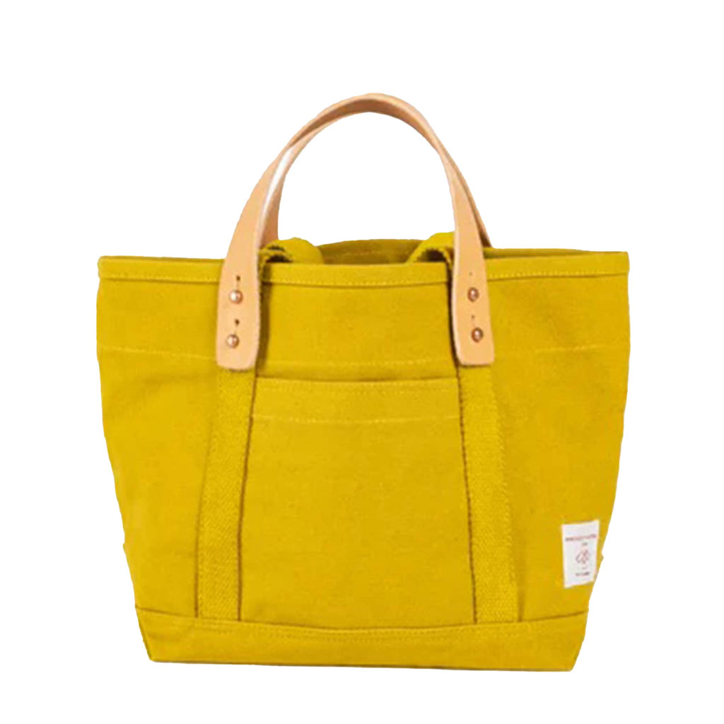 Chartreuse canvas tote bag with removable leather handles, front view, on a white background.