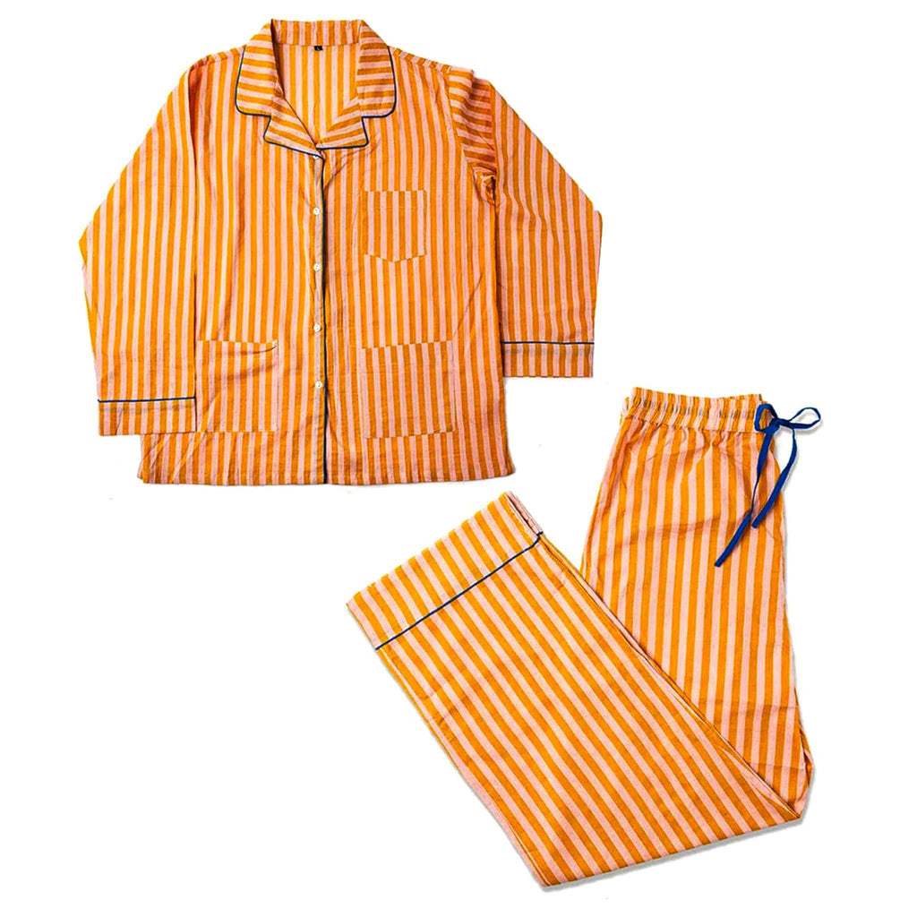 Mustard yellow and pink striped pajama set on a white background.