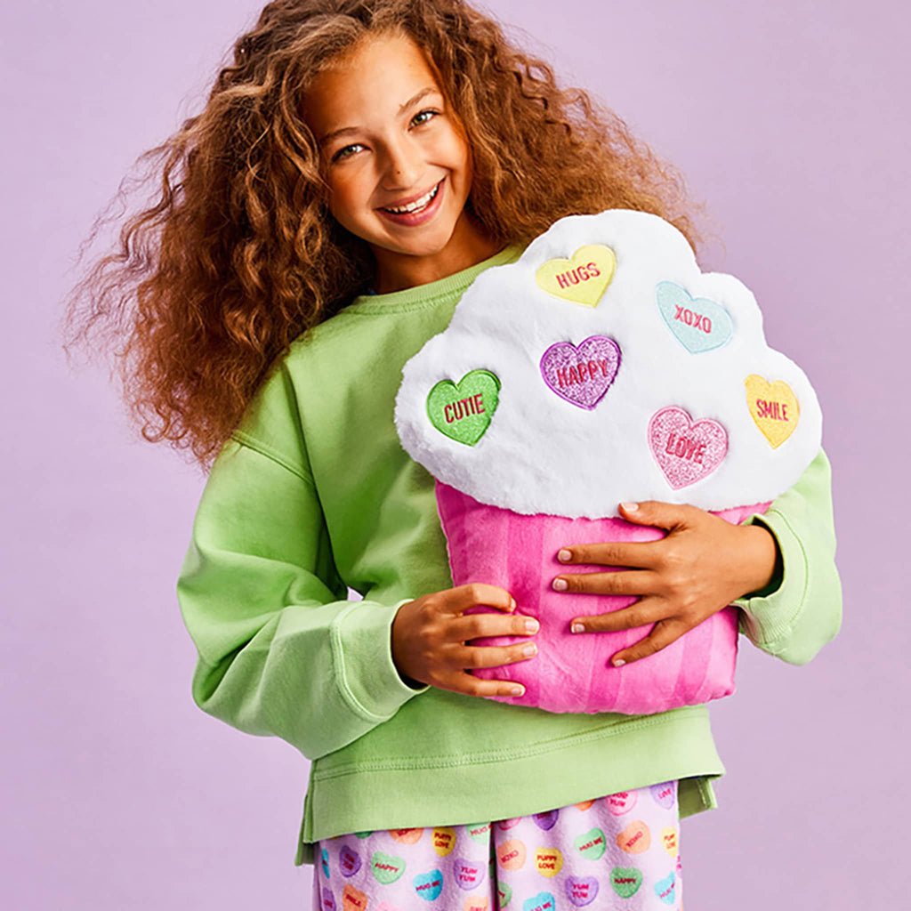 iScream Sweet Talk Cupcake Plush, shown with child for scale.