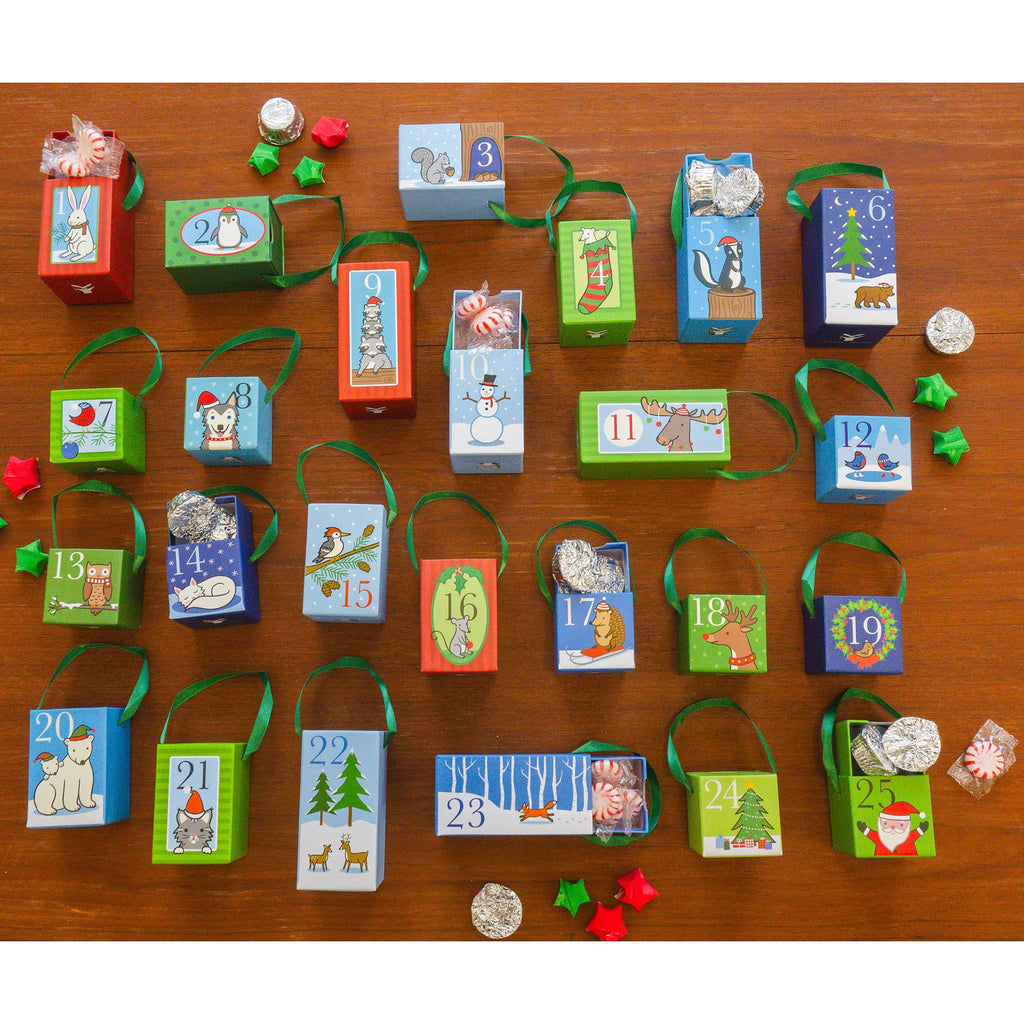 Jack Rabbit Creations Winter Woodland Matchbox reusable advent calendar, individual boxes with ribbons for hanging, some shown with treats inside.