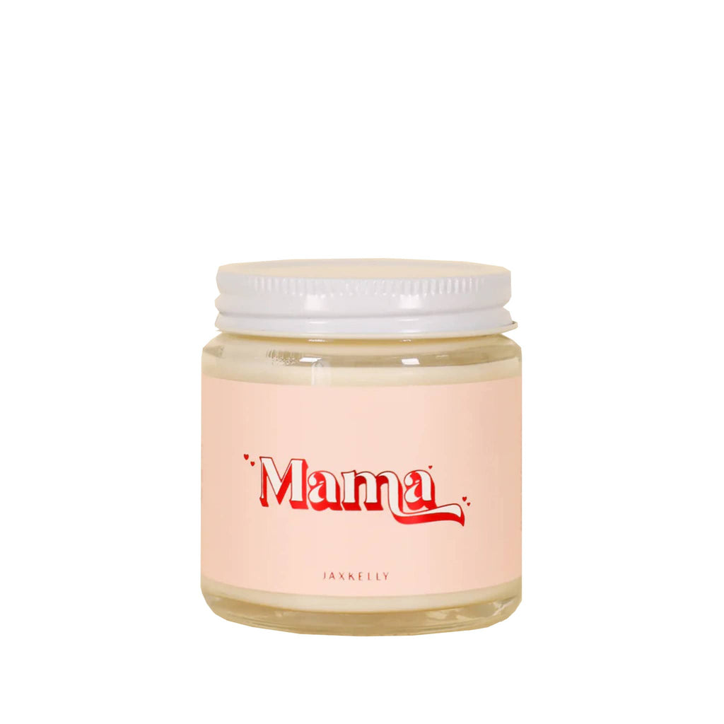 JaxKelly 4 ounce soy wax scented candle in clear glass jar with white screw-on lid and pink label with "mama" in white and red foil lettering on the front.