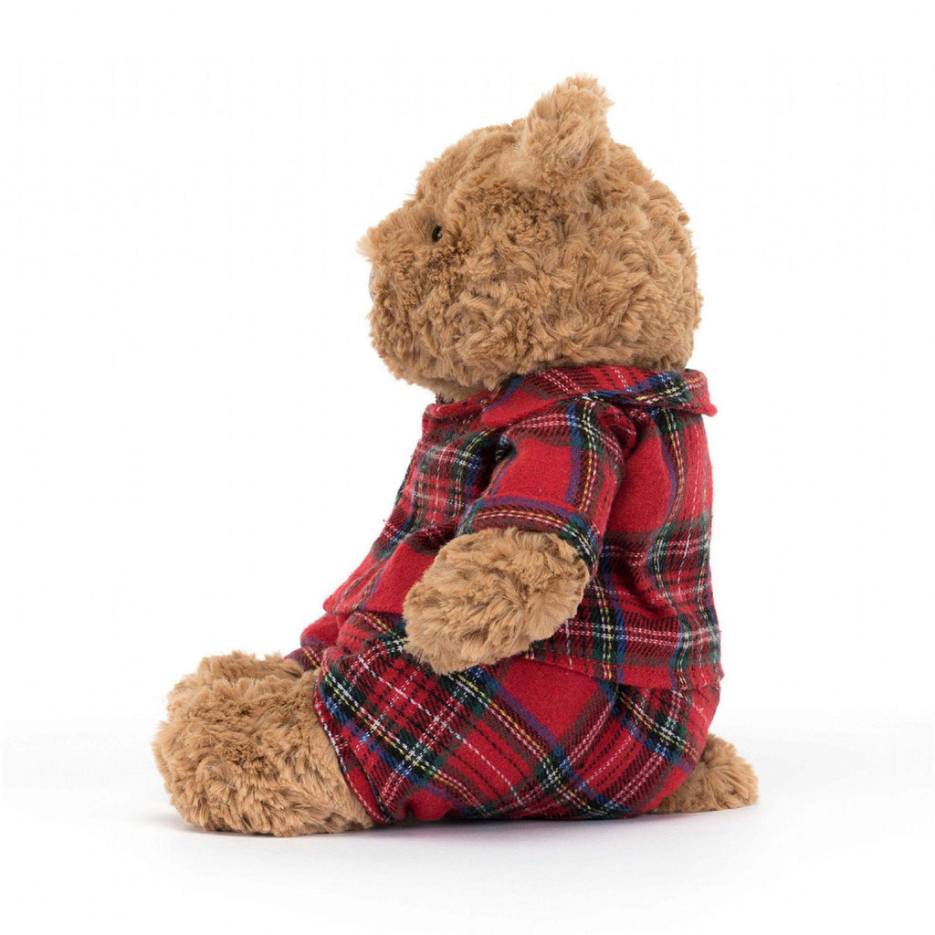 Jellycat Medium Bartholomew Bear Bedtime, gingerbread colored fur with red plaid flannel pajamas, side view.
