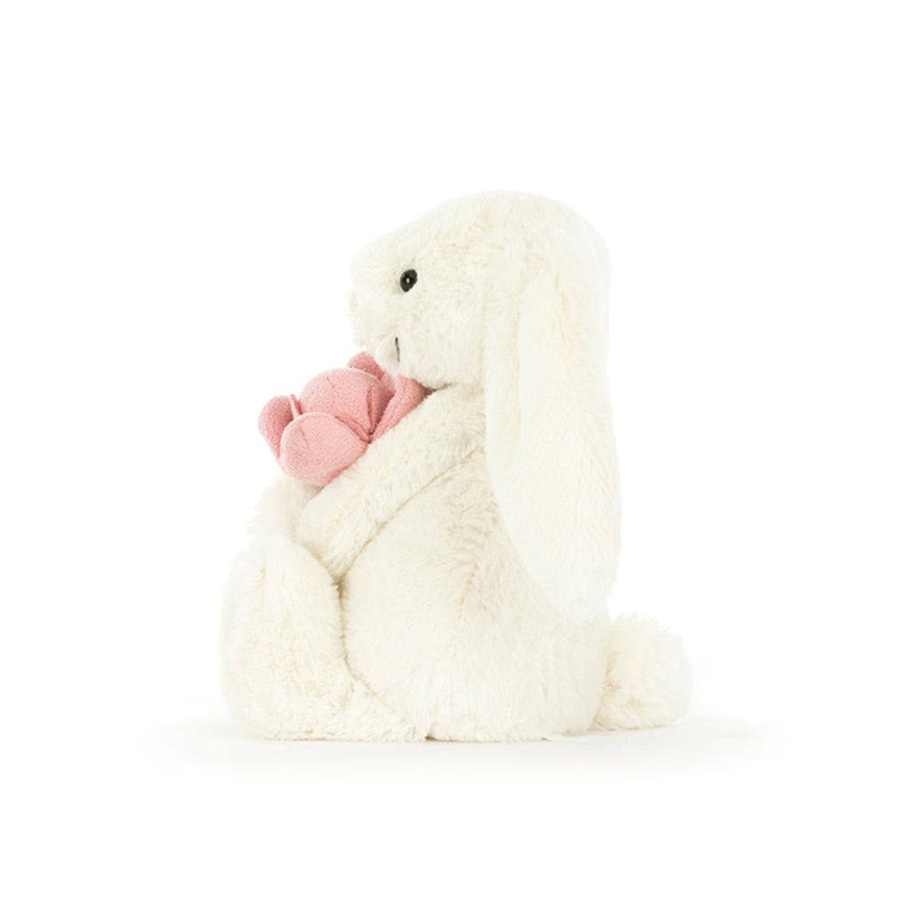 Jellycat Bashful Bunny with pink peony, side view.