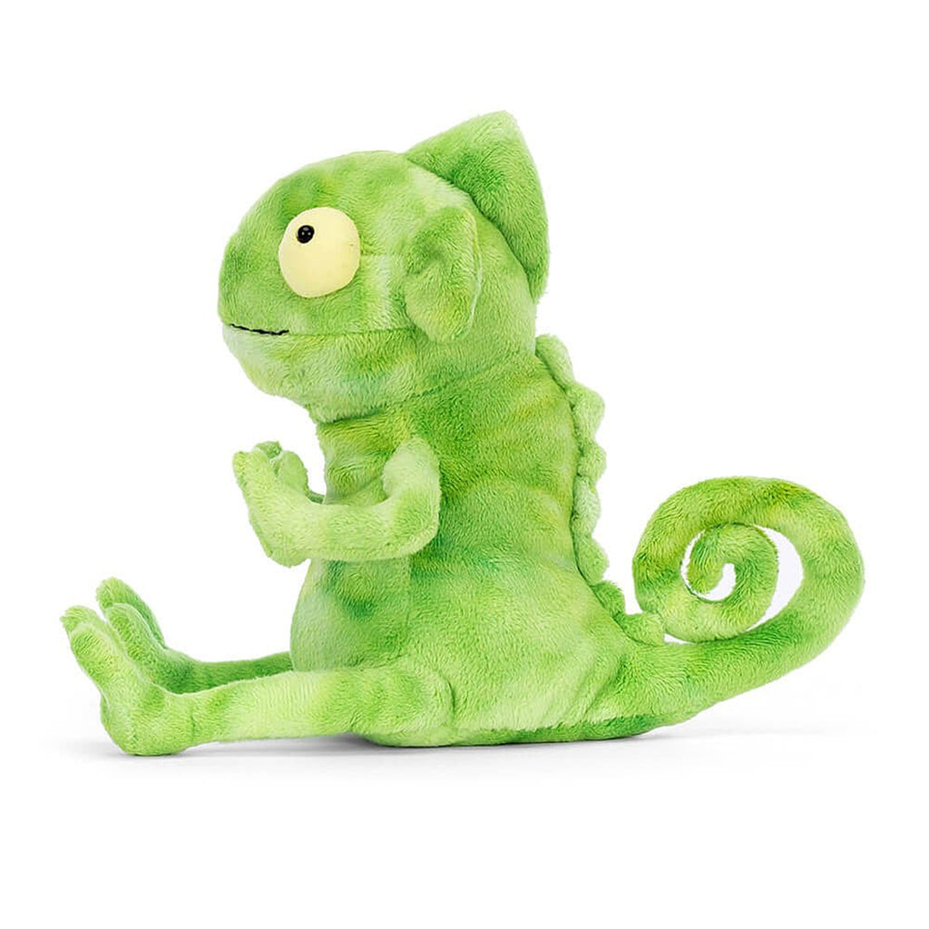 Jellycat Frankie Frilled-Neck Lizard plush toy with green ombre fur, curly tail and yellow bug eyes, side view.