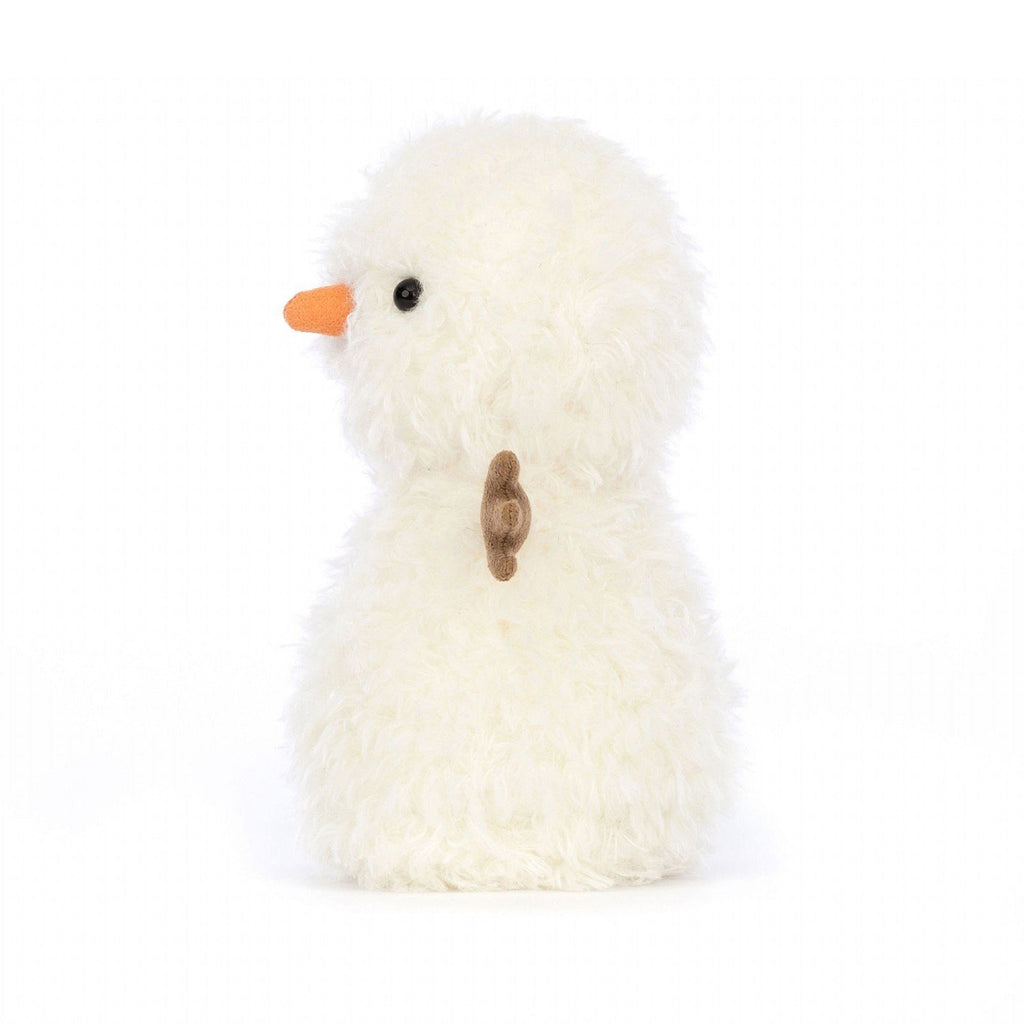 Jellycat Little Snowman plush toy with white furry body, brown stick arms, black button eyes and a suede carrot nose, side view.